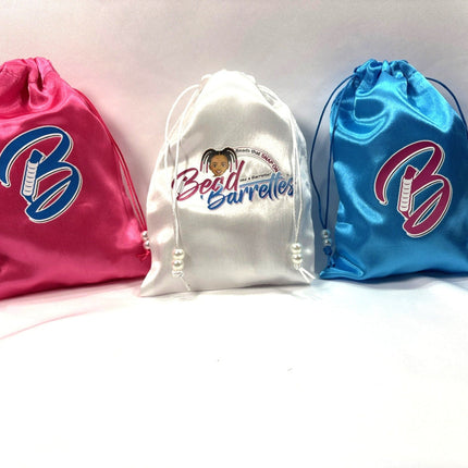 three satin Bead Barrette storage bags in colors pink, white and blue
