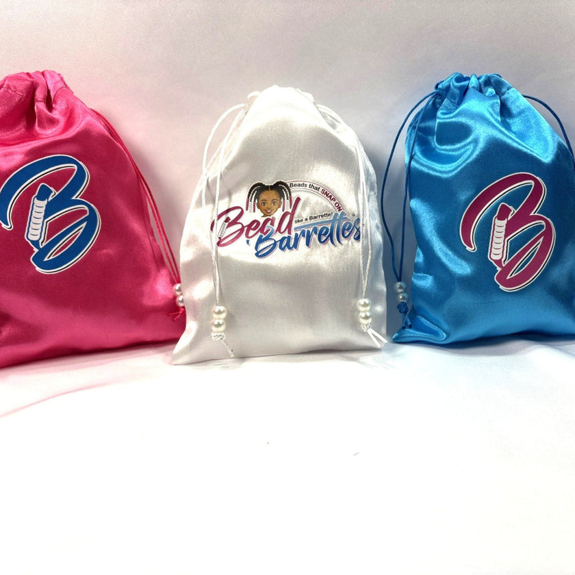 three satin Bead Barrette storage bags in colors pink, white and blue
